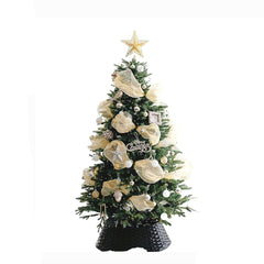 Decorated Christmas tree with gold ribbons, silver and white ornaments, star topper on black basket base