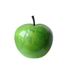 large Green apple sculpture with a stem on a white background