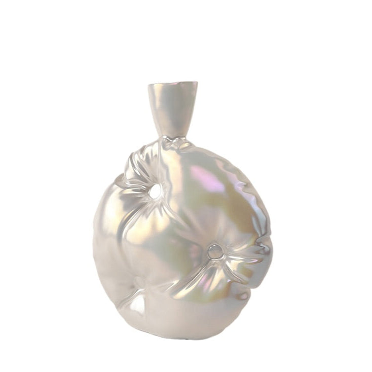 A silver ceramic vase with a handcrafted appearance, featuring a rounded body with indented texture and a narrow neck.