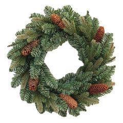 A round Christmas wreath made of green PVC with brown pine cones and brown berries on a white background.