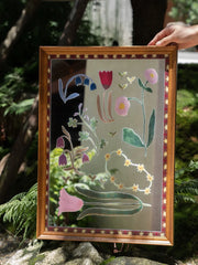 Elegant floral solid wood framed mirror wall art with a natural finish, suitable for enhancing bedroom or living room decor.