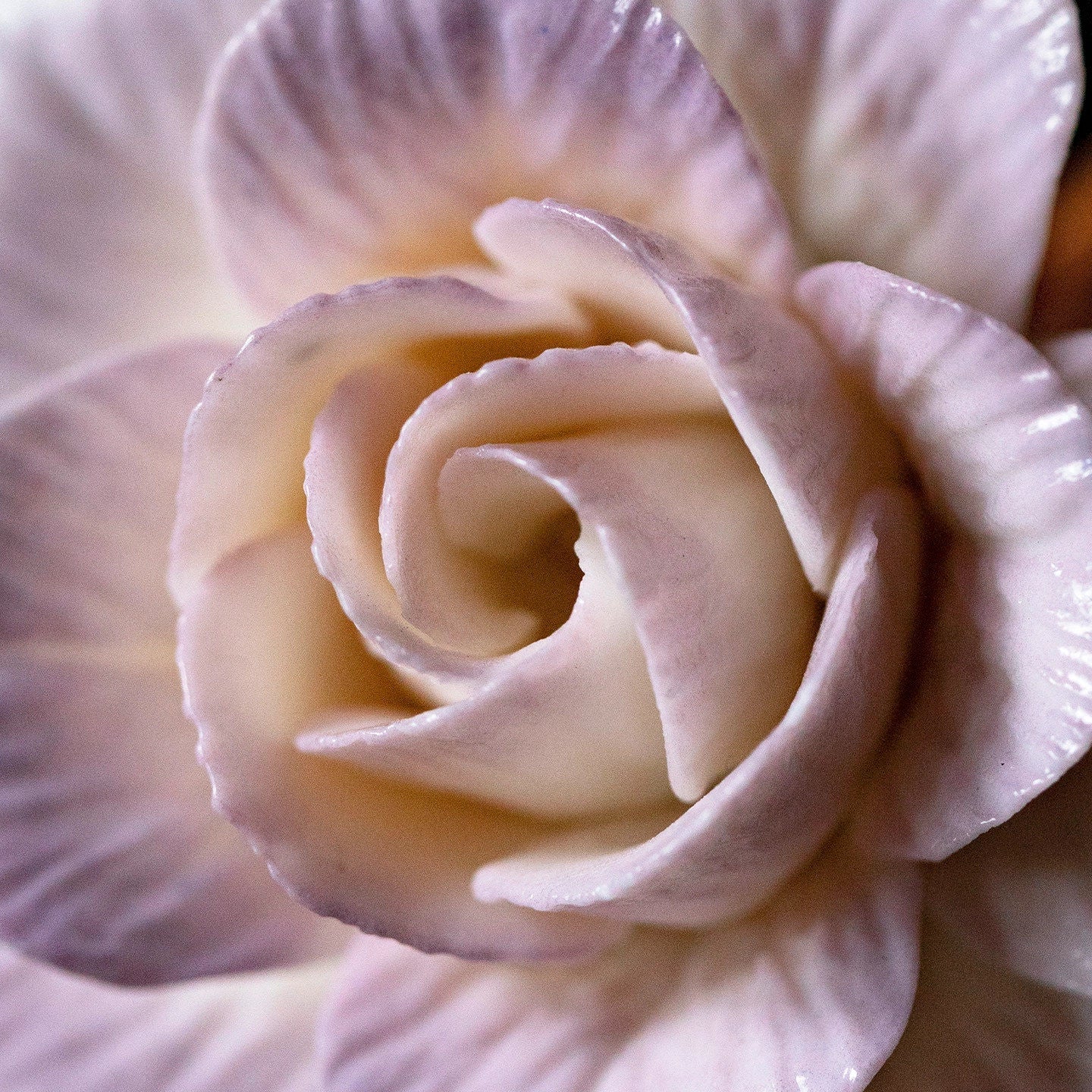 Handcrafted purple-pink camellia incense holder with detailed floral design, perfect for aromatic incense sticks.