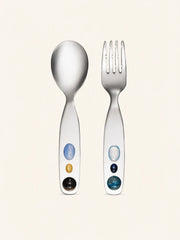 Candy Jade stainless steel spoon and fork set from SoftServe dinnerware, featuring sleek, shiny utensils on a neutral background.