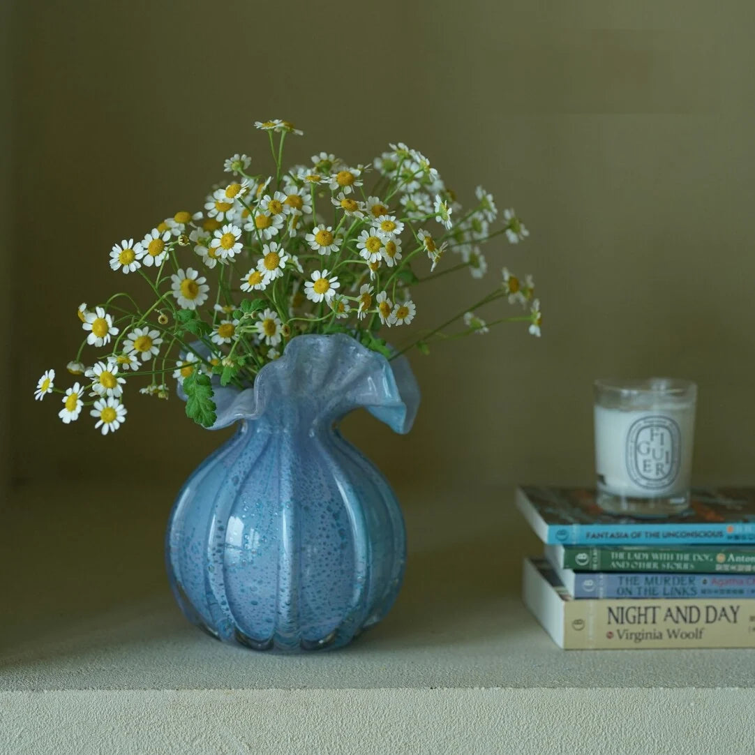 Round-bellied glass vase by TRLab Shop with clear, smooth surface and wide opening, perfect for floral arrangements.