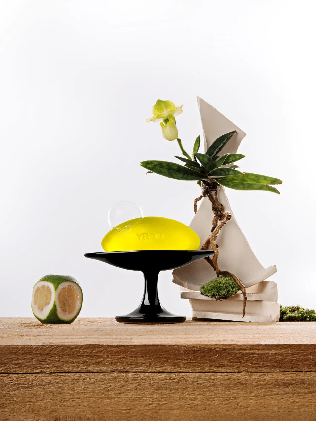 YRGD scented soap with floral and citrus accents, showcasing a smooth, colorful bar resting on a white surface.