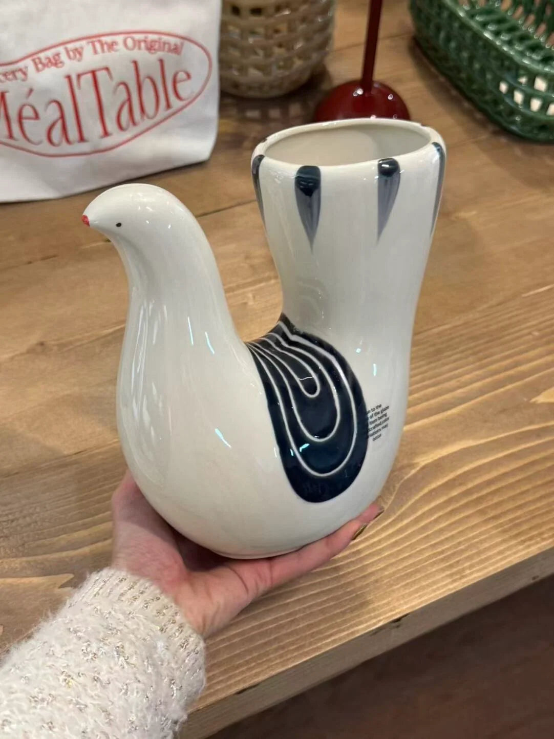 U-shaped dove ceramic vase with smooth white finish and elegant design, perfect for decorative floral arrangements.