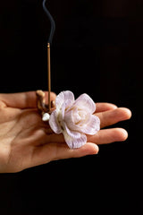 Handcrafted purple-pink camellia incense holder with detailed floral design, perfect for holding incense sticks in a decorative display.