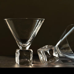 Glass wine cup with ice-cube base, clear design, and elegant shape, ideal for serving wine with a modern touch.