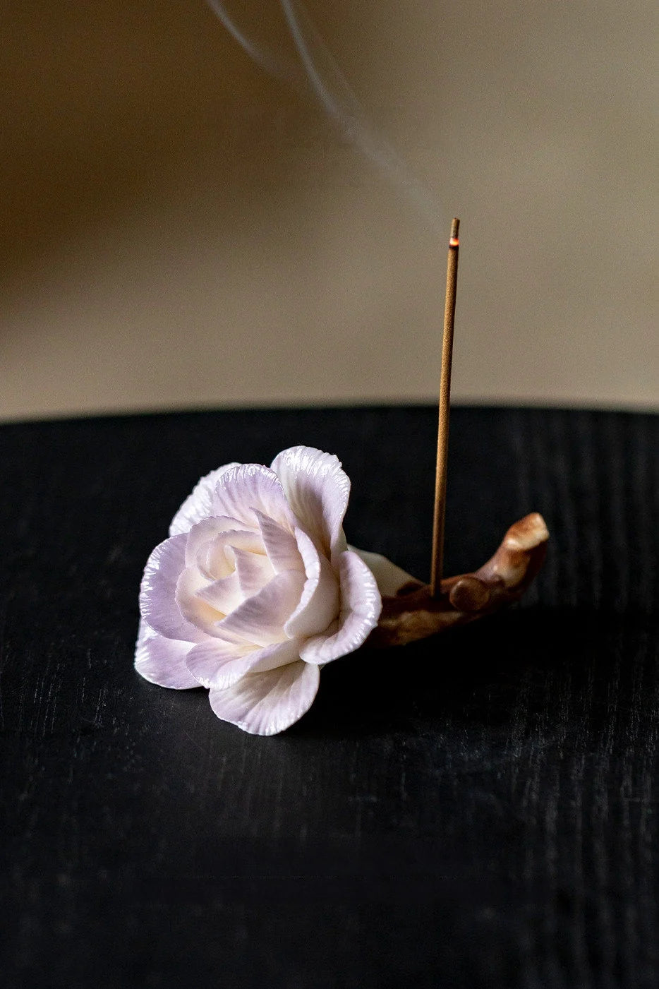 Handcrafted purple-pink camellia incense holder with intricate design, perfect for holding incense sticks.