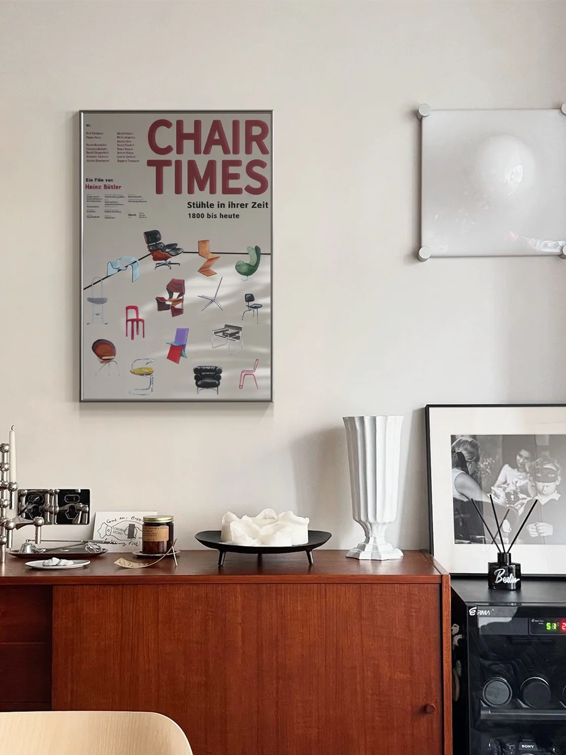 History of Chair Design mirror wall art featuring a detailed illustration of vintage chairs on a decorative background