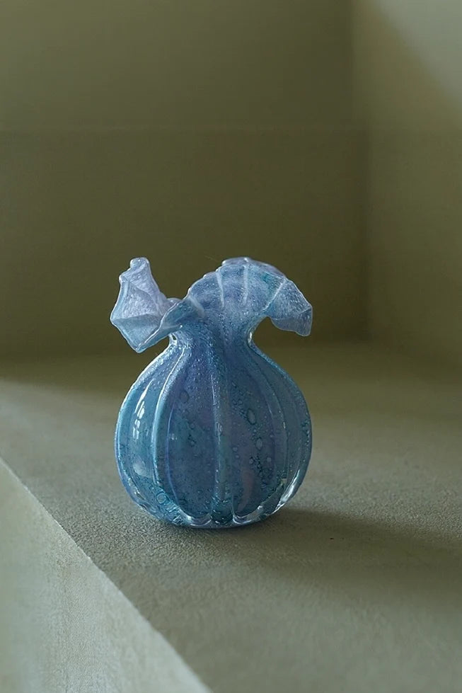 Round-bellied glass vase by TRLab Shop, featuring a clear, smooth surface and elegant shape suitable for floral arrangements.