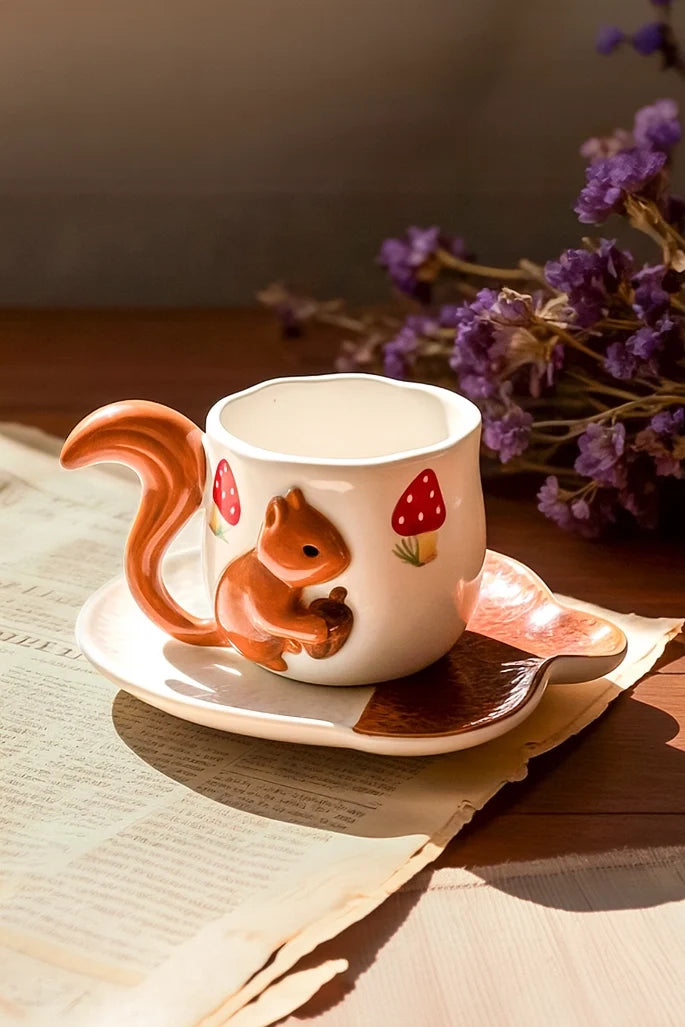 Ceramic coffee cup and saucer set with squirrel design from TRLab Shop, featuring a detailed squirrel motif on the cup and matching saucer.
