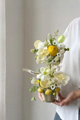 Three-lemon ceramic flower pot by TRLab Shop featuring a bright yellow lemon design and a classic round shape.