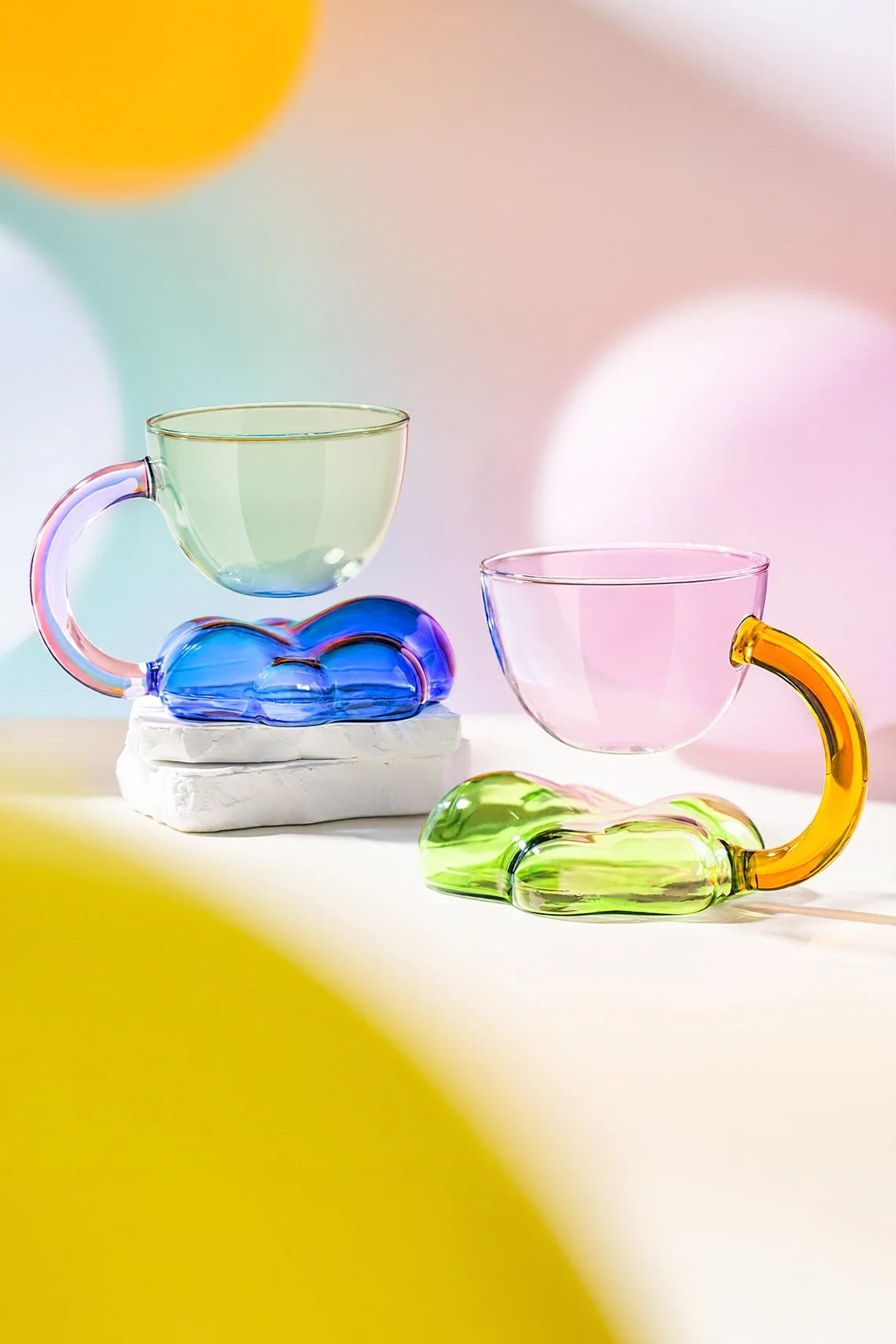 Floating Cloud Glass Coffee Cup by TRLab Shop, clear glass mug with cloud-shaped design and handle, perfect for hot beverages.