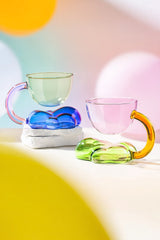 Floating Cloud Glass Coffee Cup by TRLab Shop, clear glass mug with cloud-shaped design and handle, perfect for hot beverages.