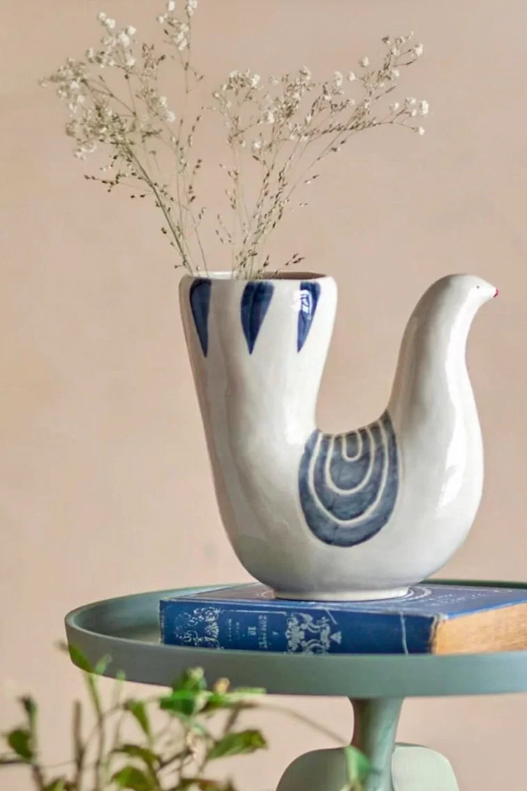 U-shaped dove ceramic vase by TRLab Shop, featuring smooth white ceramic with a dove-shaped design and sleek U-shaped form.