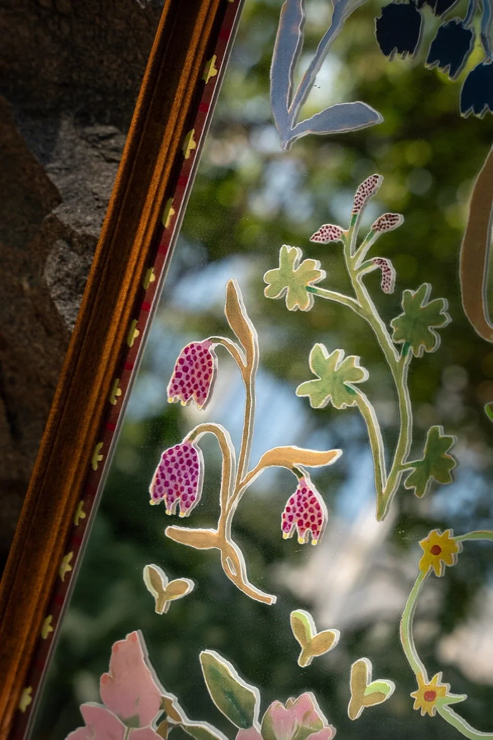Floral solid wood framed mirror wall art with a natural wood finish, featuring a botanical floral design for wall decoration.