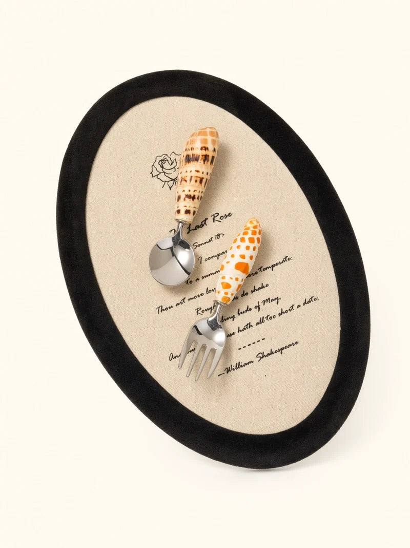 Natural Conch stainless steel spoon and fork set with elegant design, perfect for everyday use and dining.