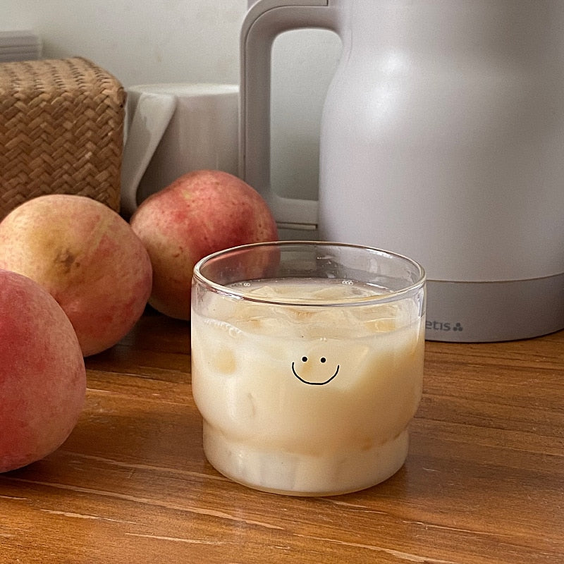 Smiley face drinking glass