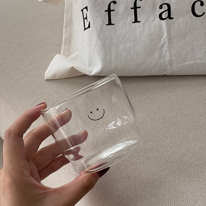 Smiley face drinking glass