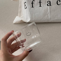 Smiley face drinking glass