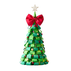 A green Christmas tree made of EVA material with flame-retardant properties, featuring a red bow on the top, gold-colored ornaments, and a silver iron base.