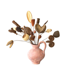Decorative arrangement of wooden hearts and leaves in a pink ceramic pitcher on a white background